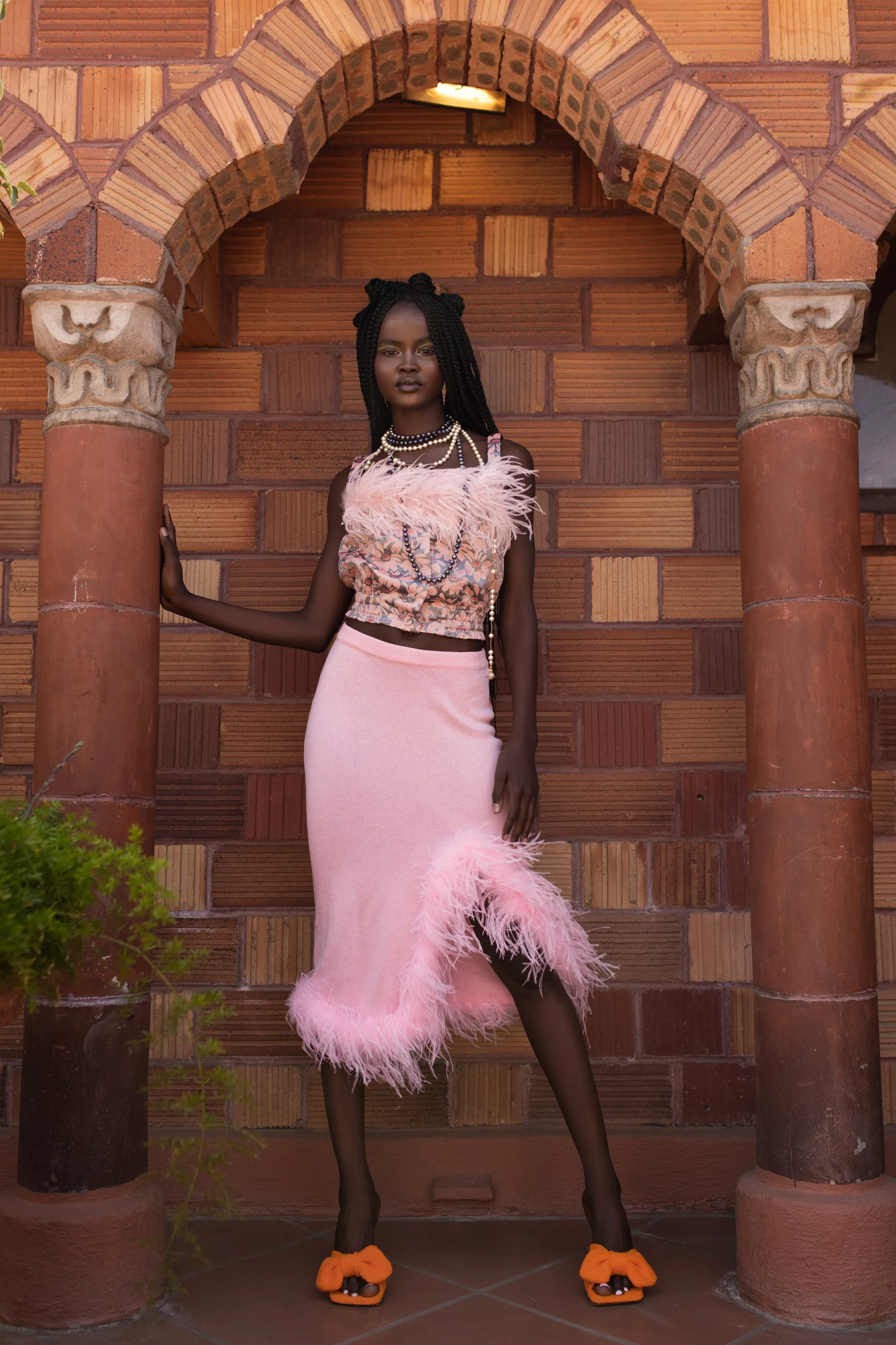 Grey flower top with pink feather details and pearl buttons