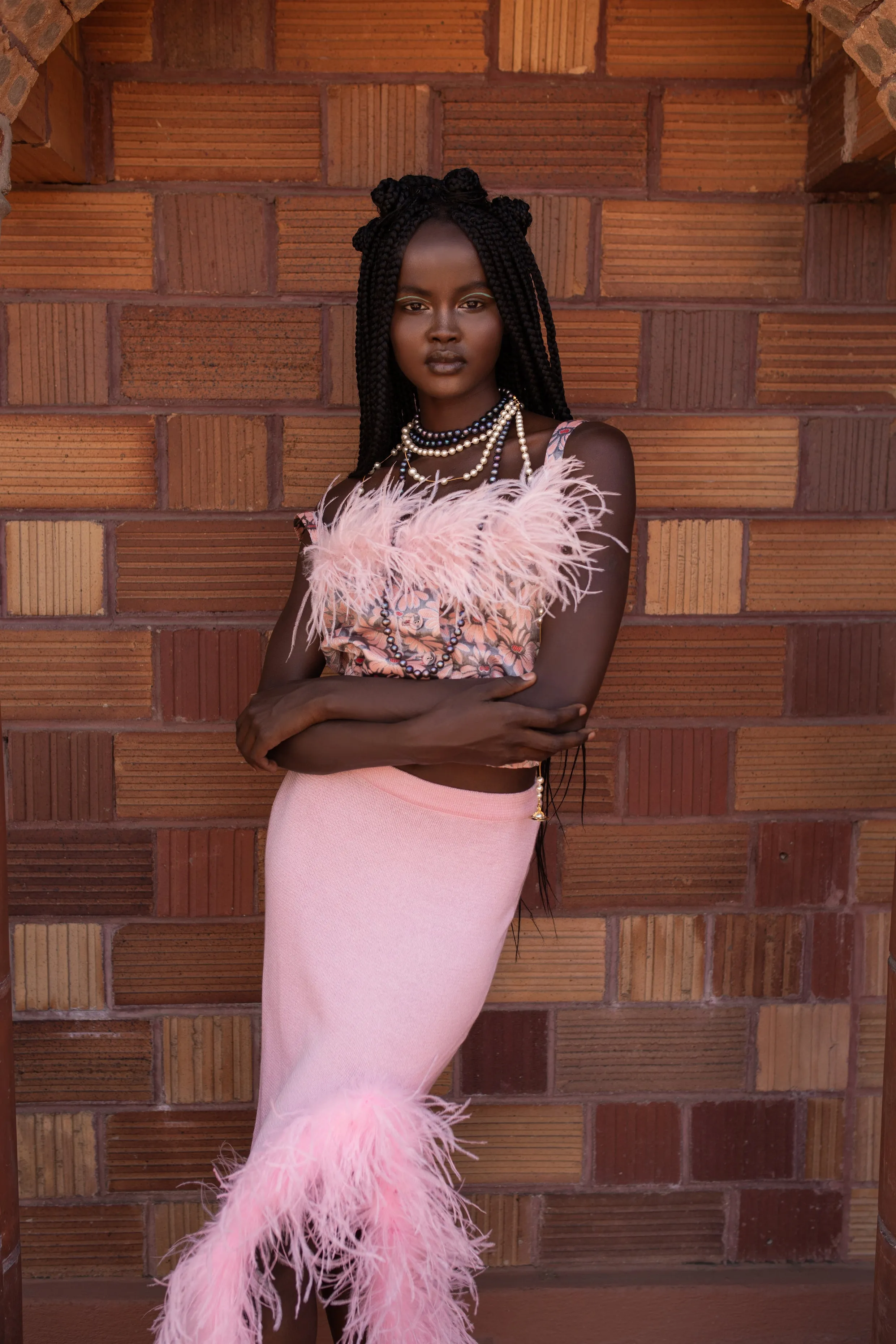 Grey flower top with pink feather details and pearl buttons